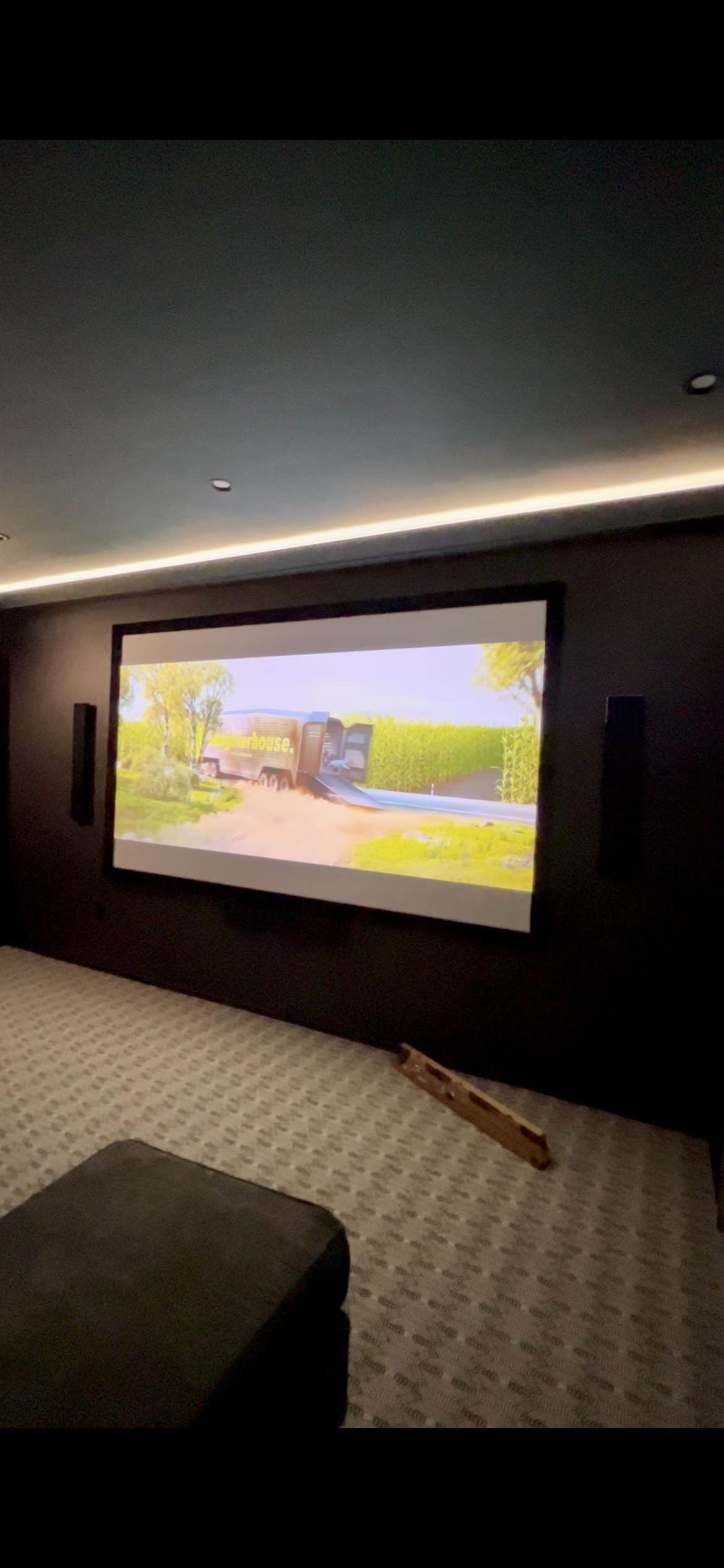 Home theater with lights on showing full room