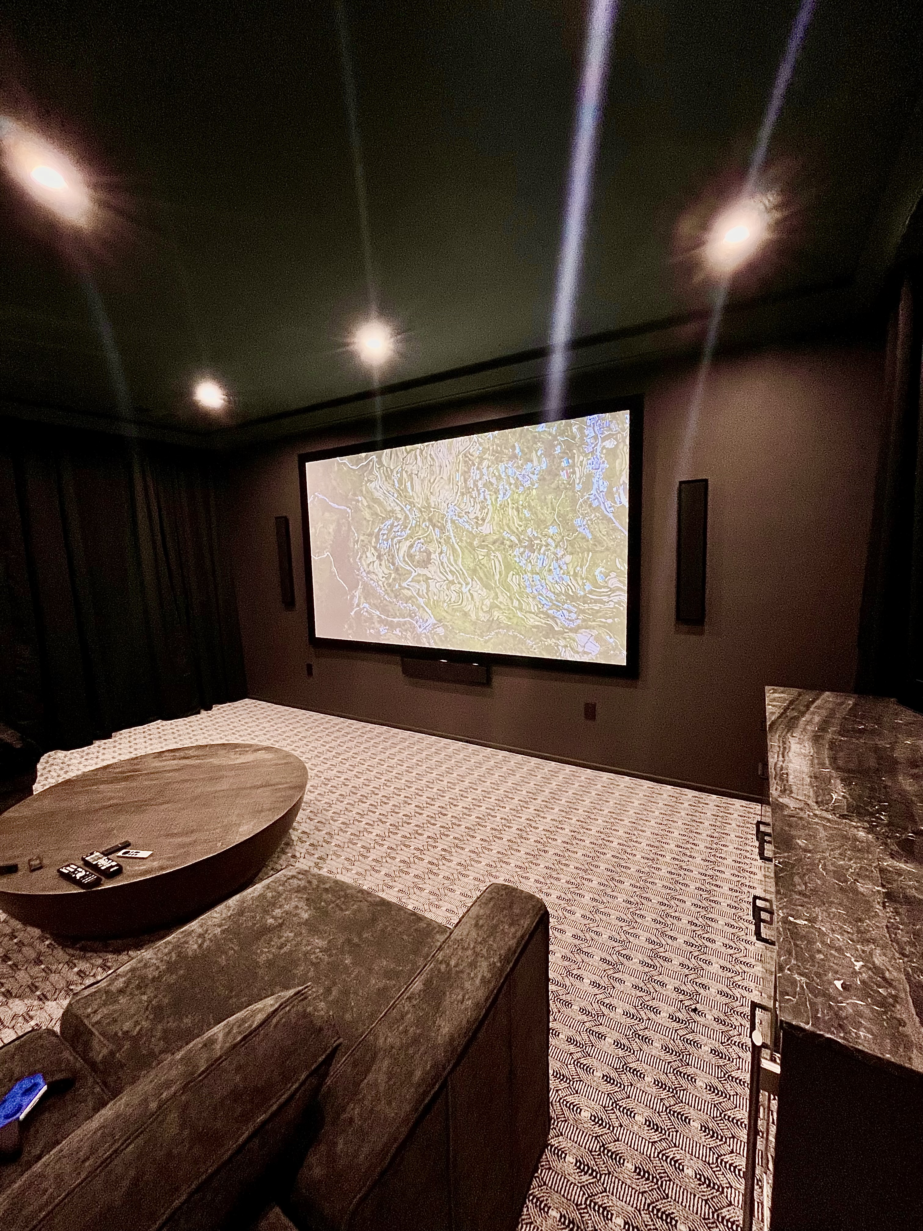 Projection screen with Martin Logan speakers in Stone Oak San Antonio home theater