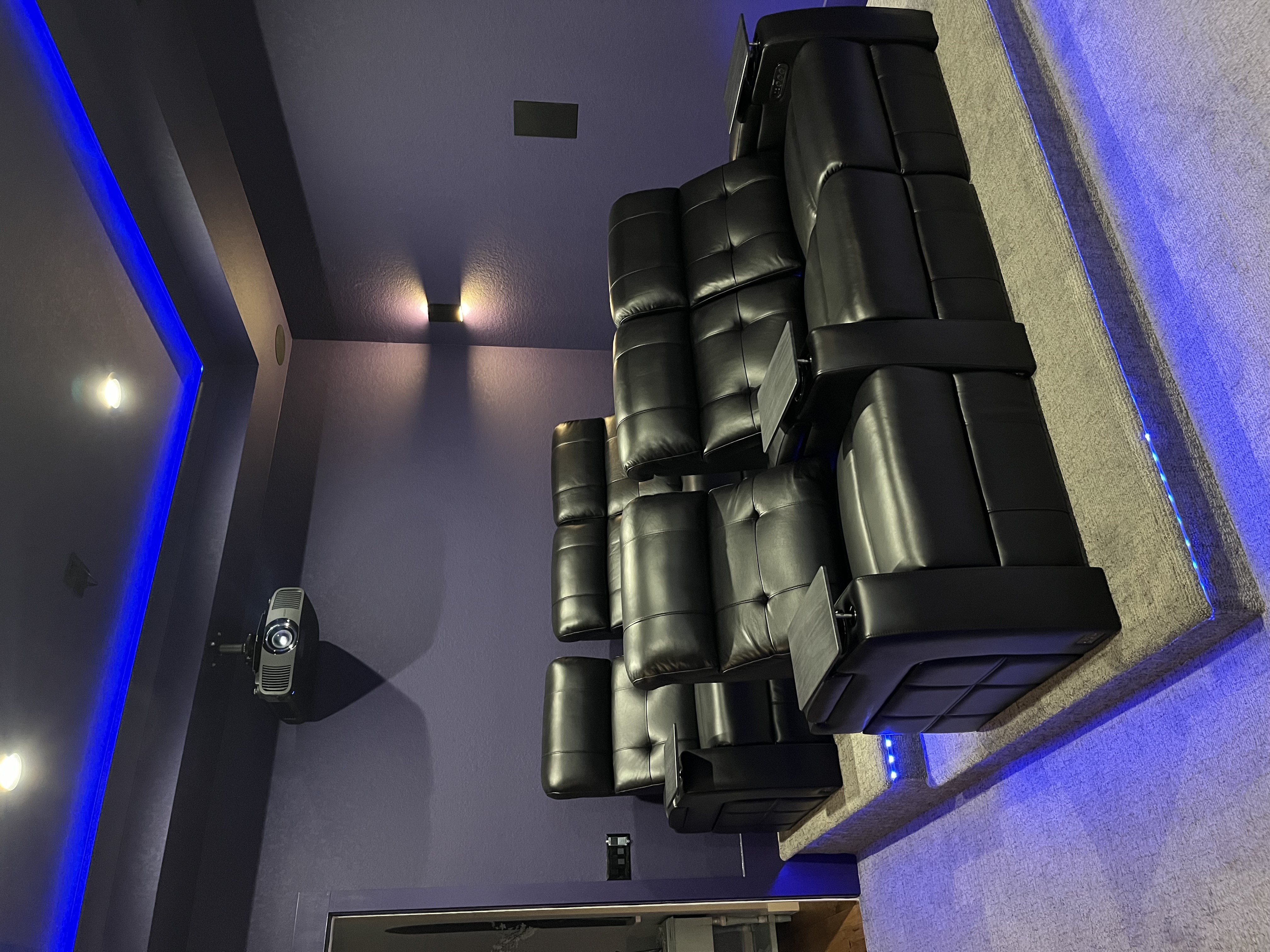 Custom home theater with leather recliners and blue LED lighting in Canyon Lake Texas