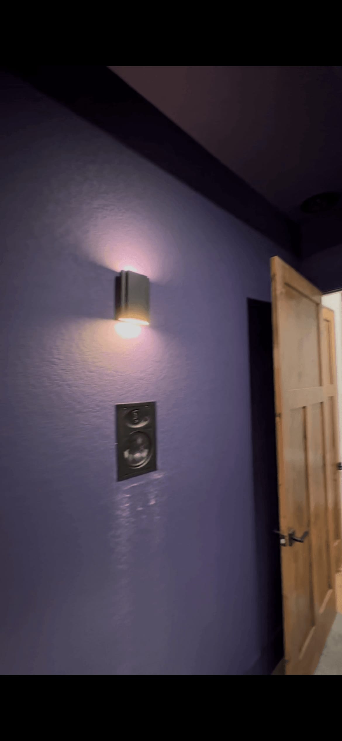 In-wall speaker installation during construction