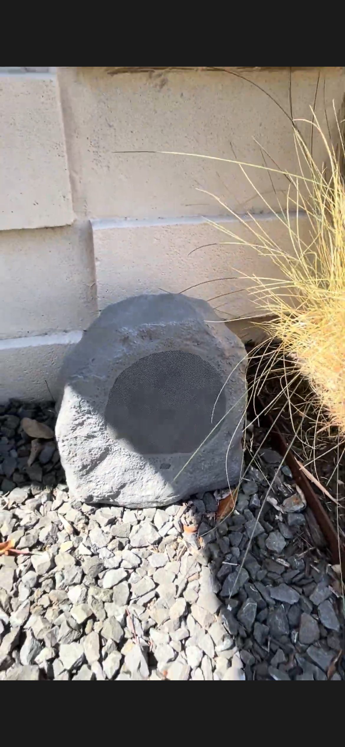 Rock speaker near sandstone pool area San Antonio TX